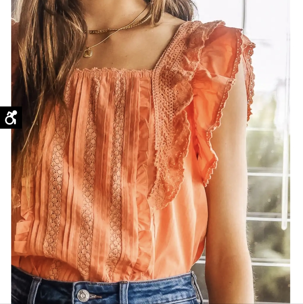 Orange frilly top